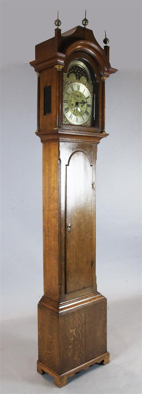 George Hewett of Marlborough. A George III oak eight day longcase clock, H.7ft 9in.
